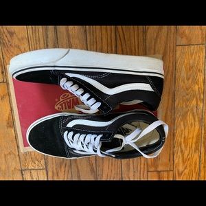Black low top old skool vans.